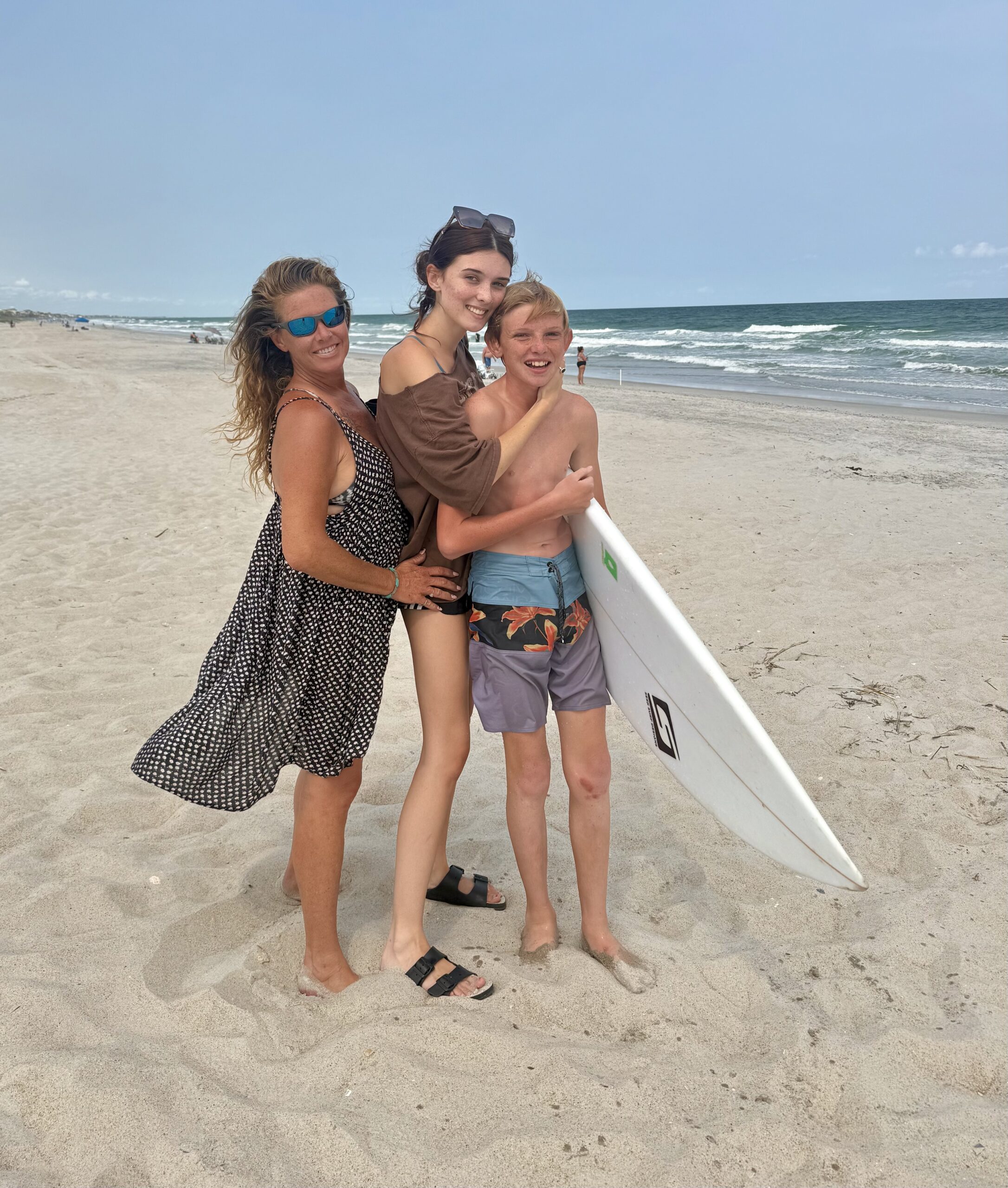 Tara McBride with her children, Sage and Storm, at the beach.